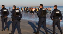 French police stand by as migrants crowd onto boats to cross Channel