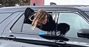 Handcuffed woman who wriggled out of police cruiser window in viral video caught days later