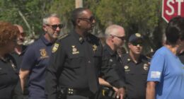 Jacksonville Sheriff T.K. Waters walks in Lakeshore neighborhood to build trust with residents and prevent crime