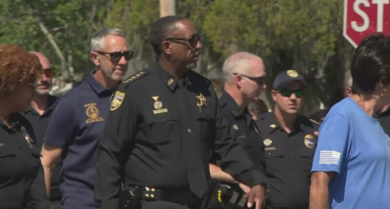 Jacksonville Sheriff T.K. Waters walks in Lakeshore neighborhood to build trust with residents and prevent crime