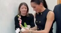 Just like a working royal! Moment Meghan hands gifted flowers to her aide during royal-style visit to children's hospital in Melbourne with Harry