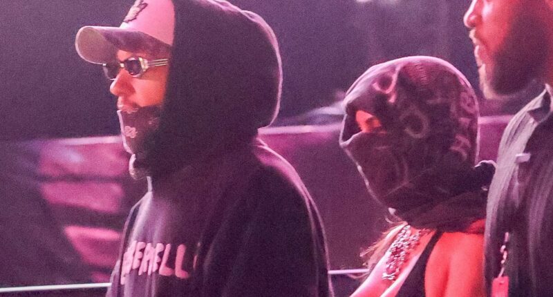 Kim Kardashian and Lewis Hamilton sweetly link arms at Coachella