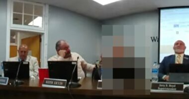 Male school board member puts arm around girl and calls her 'HOT'