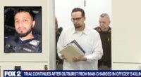 Man accused of killing cop barred from court after outburst