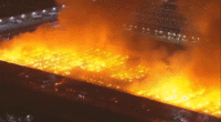Massive six-alarm blaze engulfs California warehouse, employee detained