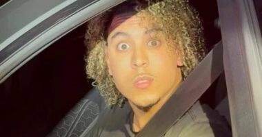 Migrant filmed hurling vile abuse at female cop and vowing to make her his 'slave' moans he is the victim of racism after being shamed over his behavior