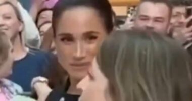 Moment Meghan Markle appears to GLARE at an adviser