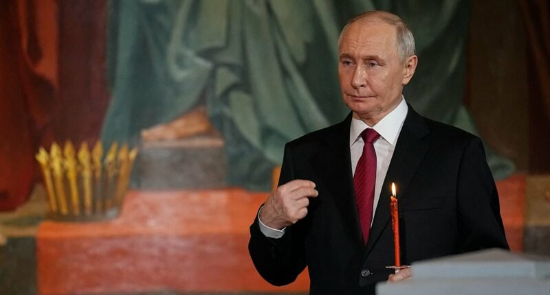 Moment Putin strolls into Easter Sunday service in Moscow - as Elon Musk's father watches on - after 'breaking Kremlin-declared ceasefire'