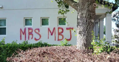 Neighbors alarmed by messages painted across Horizon West home
