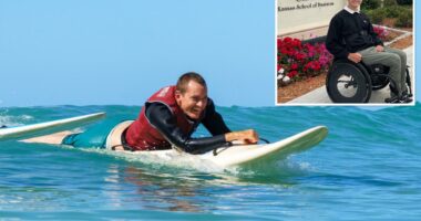 Paralyzed surfer returns to the water on adapted board