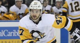 Paramedics responding to ice hockey star Adam Johnson's fatal neck injury during match were forced to climb barriers to get to him in 'chaotic scene', inquest hears