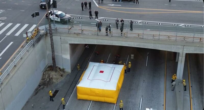 Person threatening to jump freezes 101 Freeway traffic for hours as SWAT and LAPD descend