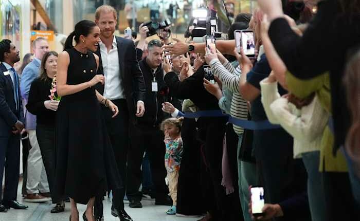 Prince Harry and Meghan arrive in Australia for a low-key, privately funded visit