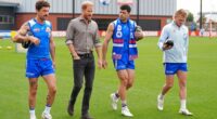 Prince Harry, center left, The Duke of Sussex, meets Western Bulldogs players during a visit to Movember at the Western Bulldogs HQ at Mission Whitten Oval, in Footscray, a suburb of Melbourne, Australia Wednesday, April 15, 2026. (Jonathan Brady/Pool Photo via AP)
