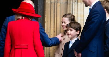 Princess Charlotte gets a loving pat from her grandfather King Charles