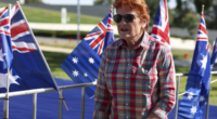 Hundreds gathered on Parliament's lawn draped in the flag with One Nation leader Pauline Hanson leading the rally.