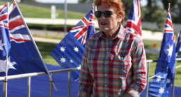 Hundreds gathered on Parliament's lawn draped in the flag with One Nation leader Pauline Hanson leading the rally.