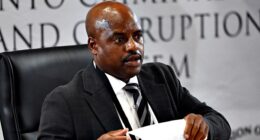 South African ex-police chief gets tissue stuck on forehead while sweating during corruption inquiry