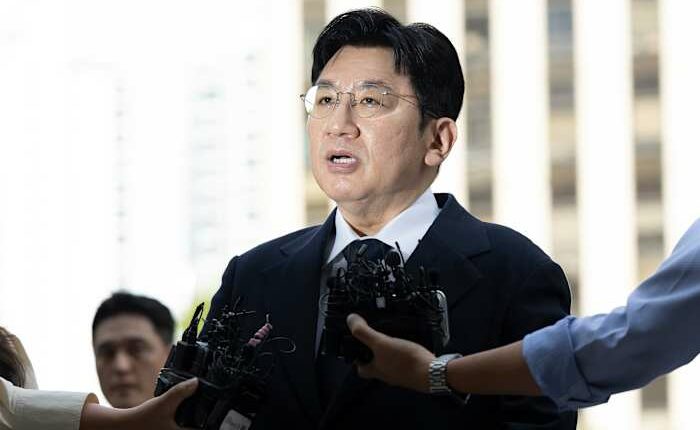 South Korean police seek to arrest K-pop mogul behind BTS