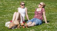 Sun-starved Britons flock to the seaside as temperatures reach 26C
