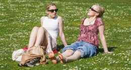 Sun-starved Britons flock to the seaside as temperatures reach 26C