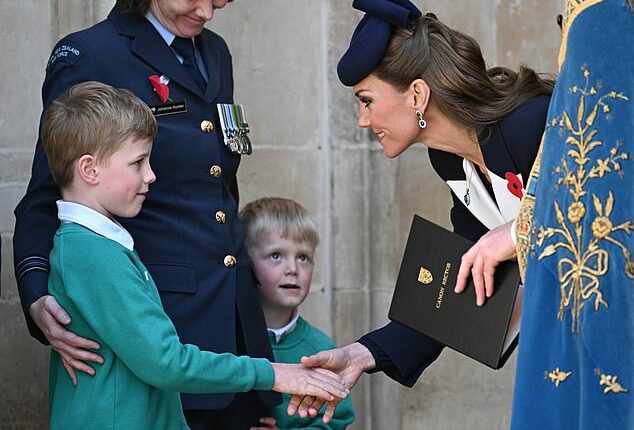 Kate was spotted speaking to two boys after she left the service of commemoration at Westminster Abbey