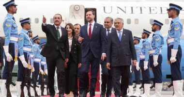 US Vice President JD Vance, centre, walks with Pakistan's Chief of Defence Forces and Chief of Army Staff Field Marshall Asim Munir, left, and Pakistani Deputy Prime Minister and Foreign Minister Mohammad Ishaq Dar