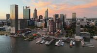 Perth, Australia - March 27, 2025: Drone photograph of buildings around Elizabeth Quay at sunset.
