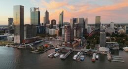 Perth, Australia - March 27, 2025: Drone photograph of buildings around Elizabeth Quay at sunset.
