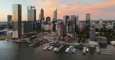 Perth, Australia - March 27, 2025: Drone photograph of buildings around Elizabeth Quay at sunset.
