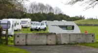 Travellers 'smash through fence' to occupy Edinburgh landmark