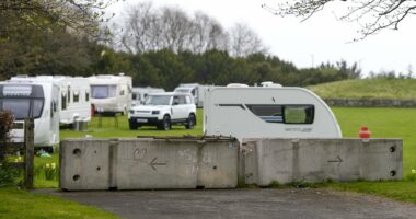 Travellers 'smash through fence' to occupy Edinburgh landmark