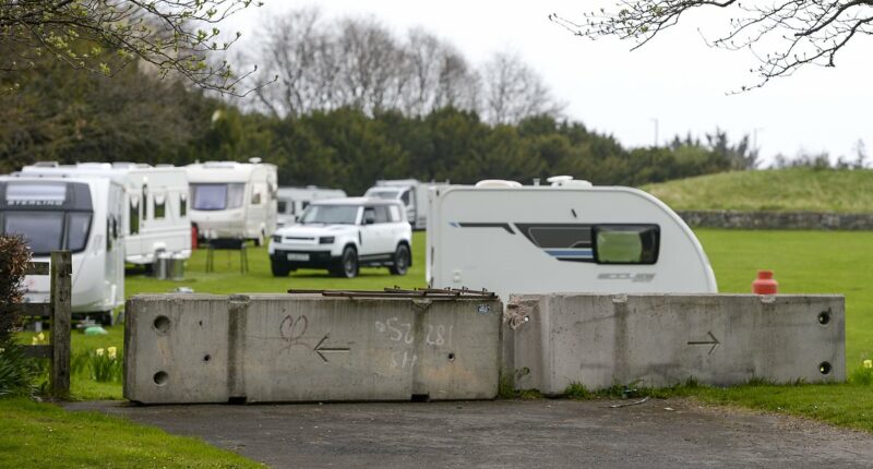 Travellers 'smash through fence' to occupy Edinburgh landmark