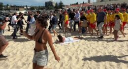 'Unbothered' Aussie steals the show from Harry and Meghan after footage captured priceless moment at the beach: 'Give her a medal'