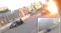 Video shows Israeli woman knocked to the ground as missile explodes next to her -- before getting up and walking away