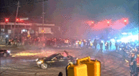 WATCH: Illegal street racing 'takeover' explodes as hundreds swarm streets and suspects bolt