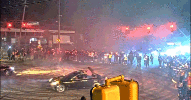 WATCH: Illegal street racing 'takeover' explodes as hundreds swarm streets and suspects bolt