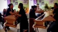 Wild video captures women brawling across coffin at funeral after learning they both dated the dead man