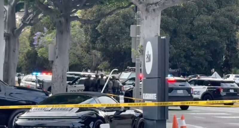 Armed suspect barricades himself with hostage in Beverly Hills