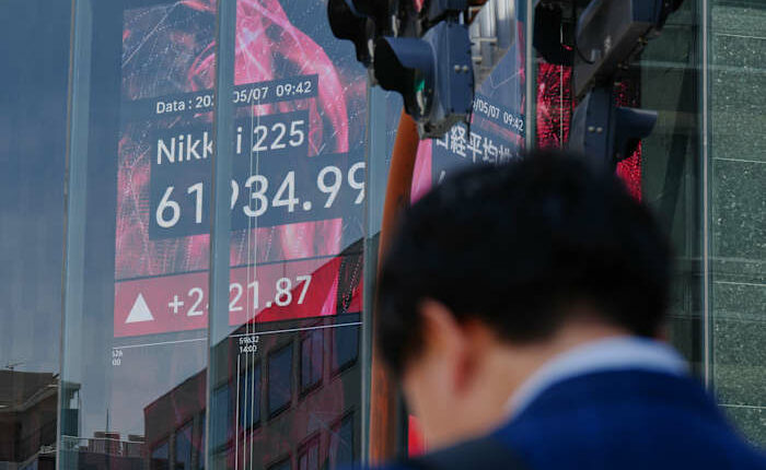 Asian shares mostly gain and oil prices fall after Trump says peace talks on Iran war are proceeding