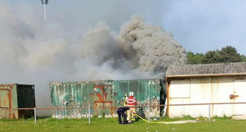 Boy saved after he was trapped in burning storage container
