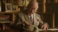 First class! Sir David Attenborough gets a surprise centenary message from King Charles and Queen Camilla - delivered with help from royal pooch