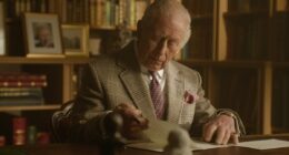 First class! Sir David Attenborough gets a surprise centenary message from King Charles and Queen Camilla - delivered with help from royal pooch