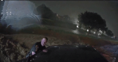 Heart-stopping video shows officers use unlikely tool to save family trapped in floodwaters