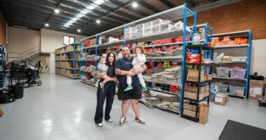 The Kozma family pose together inside one of the Waves Never Die warehouses.