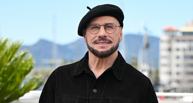 John Travolta explains THAT viral beret look at Cannes