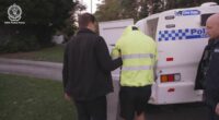 Detectives revealed the investigation began after police uncovered an Australian network of more than 700 alleged offenders sharing child abuse material.