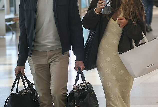 Newlyweds Jacqui Burfoot and Clint Rice looked keen to keep a low profile when they were spotted at Sydney Airport on Friday