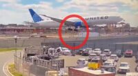 Moment United flight hits light pole and truck while landing