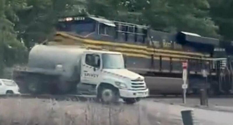 Moment a fully loaded septic truck T-boned by a speeding freight train